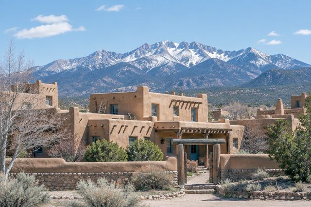 Cardiology billing services in New Mexico: Santa Fe adobe buildings with the Sangre de Cristo Mountains